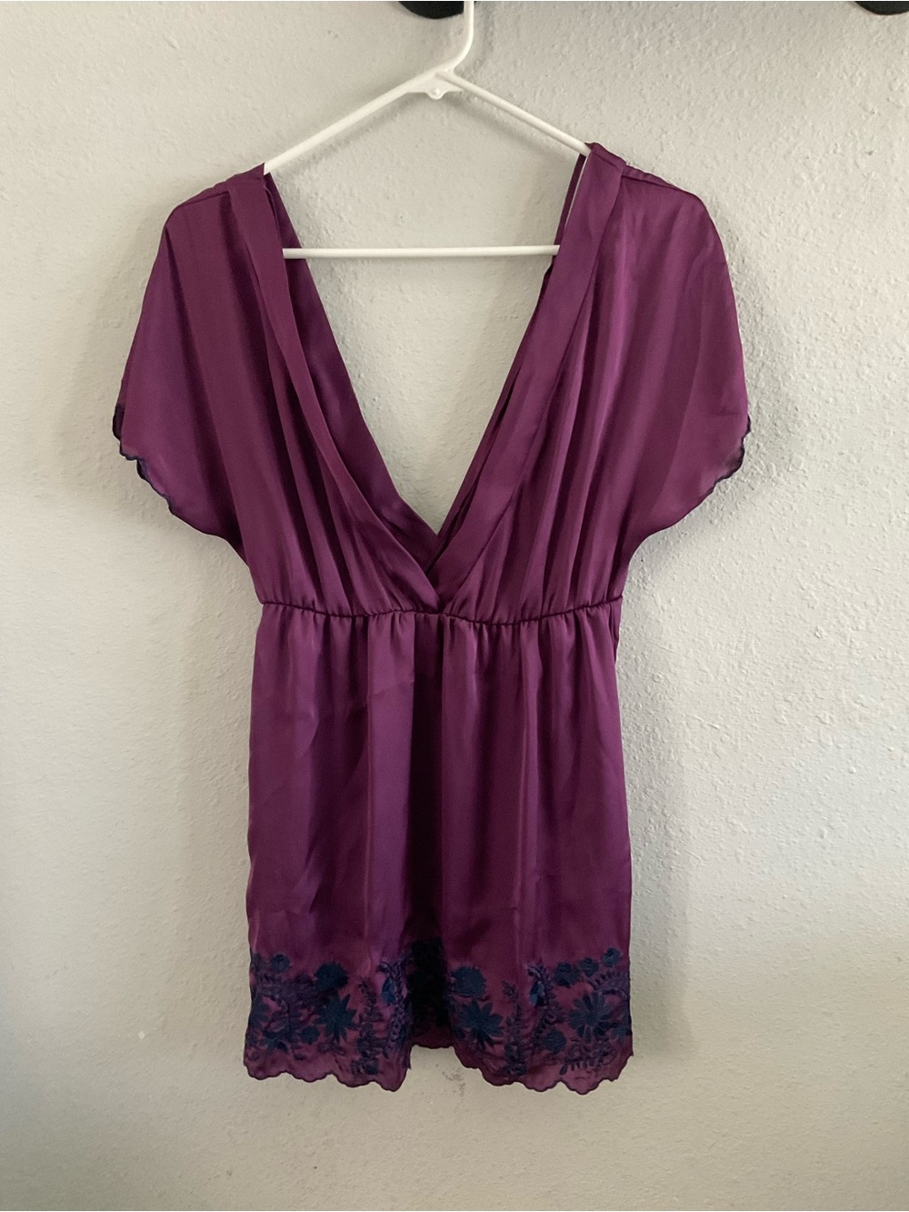Plum V-Neck Blouse with Navy Embroidered Hem